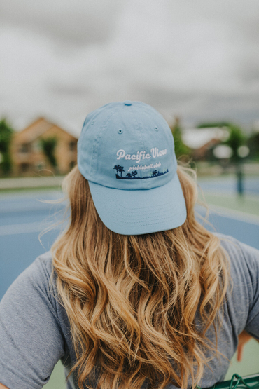 Customer wearing a VC300 Valucap Bio-Washed Cap